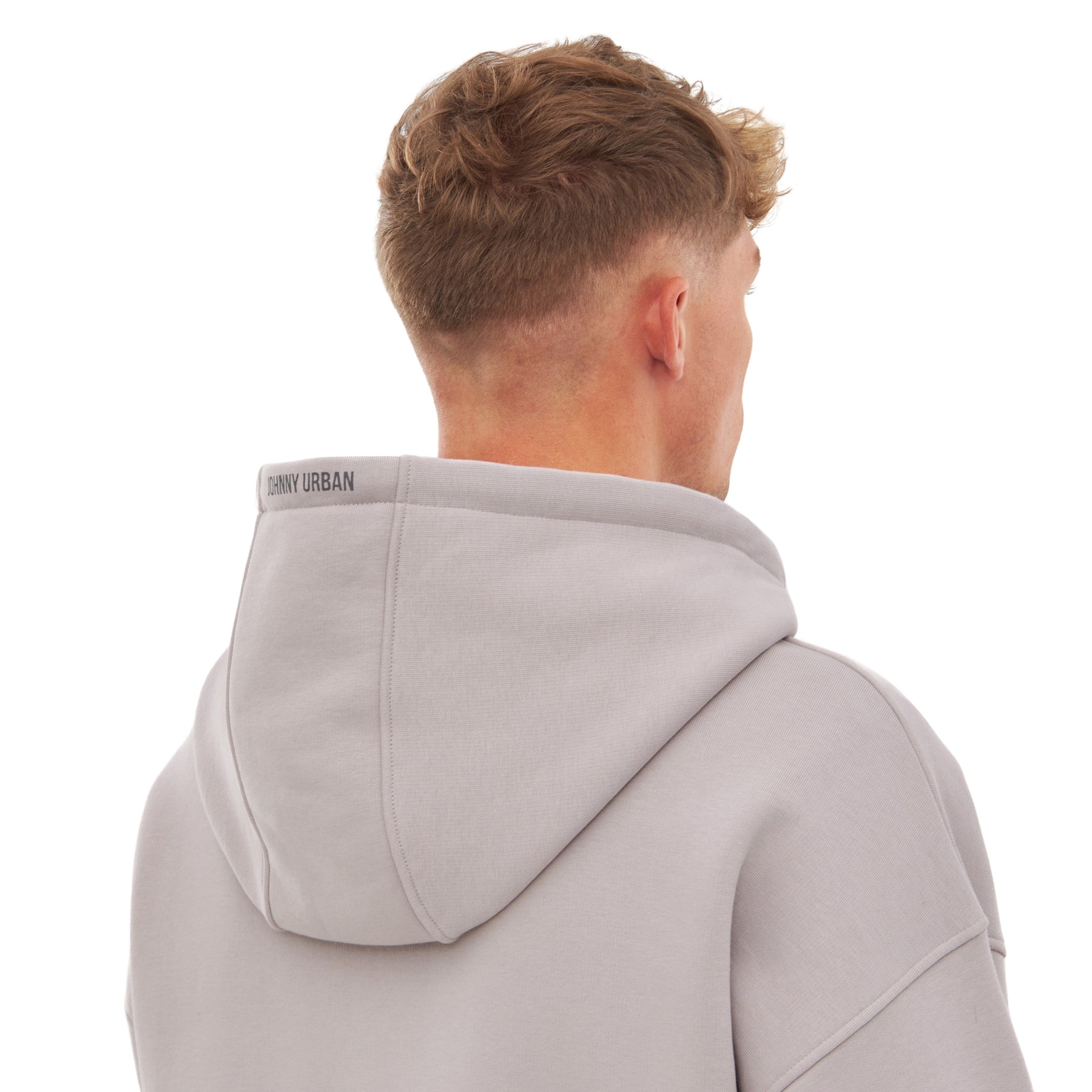 Rückansicht eines Mannes mit kurzem Haar, der einen oversized Zip Hoodie 'Caleb' in Grau-Beige von Johnny Urban trägt