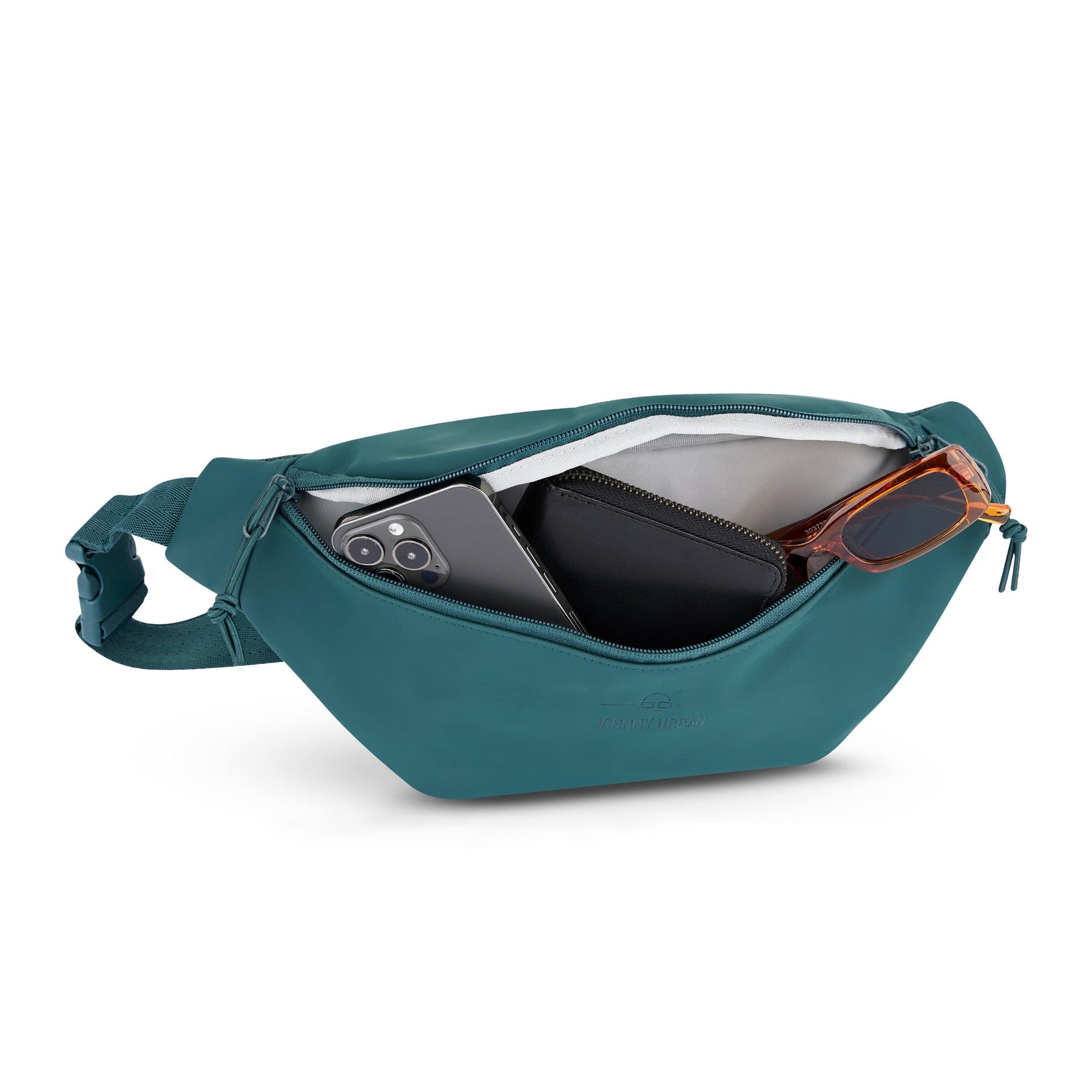 Bauchtasche 'Riley' in petrolgrün mit geöffnetem Reißverschluss, Handy, schwarzes Portemonnaie und Sonnenbrille darin