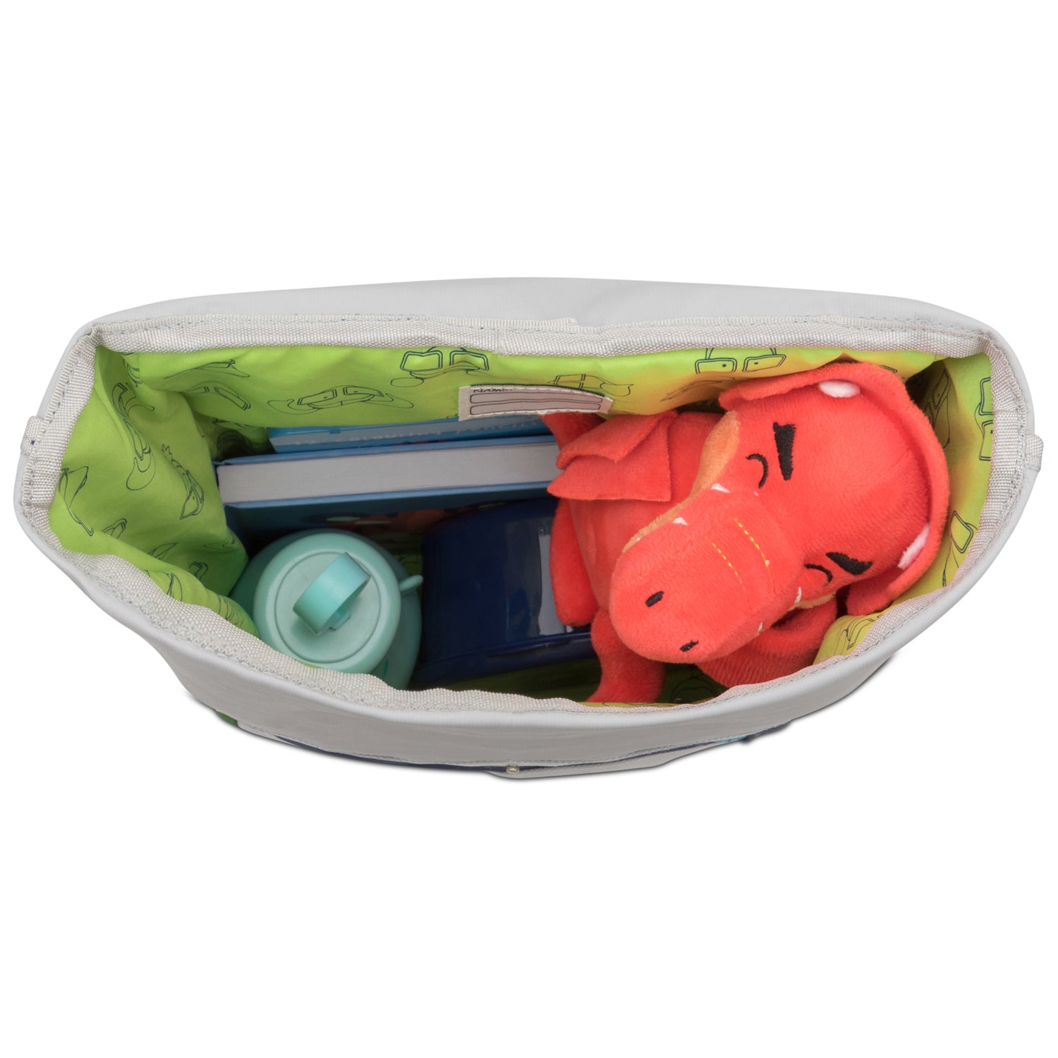 Blick in den Rolltop Kinderrucksack 'Aaron' mit grünem Innenfutter, rotem Stofftier Drachen, Wasserkunststoffflasche und Büchern