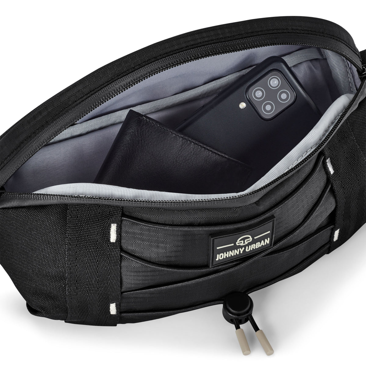 Schwarze Johnny Urban Bauchtasche 'Devin' mit geöffnetem Hauptfach, Smartphone und Geldbörse innen